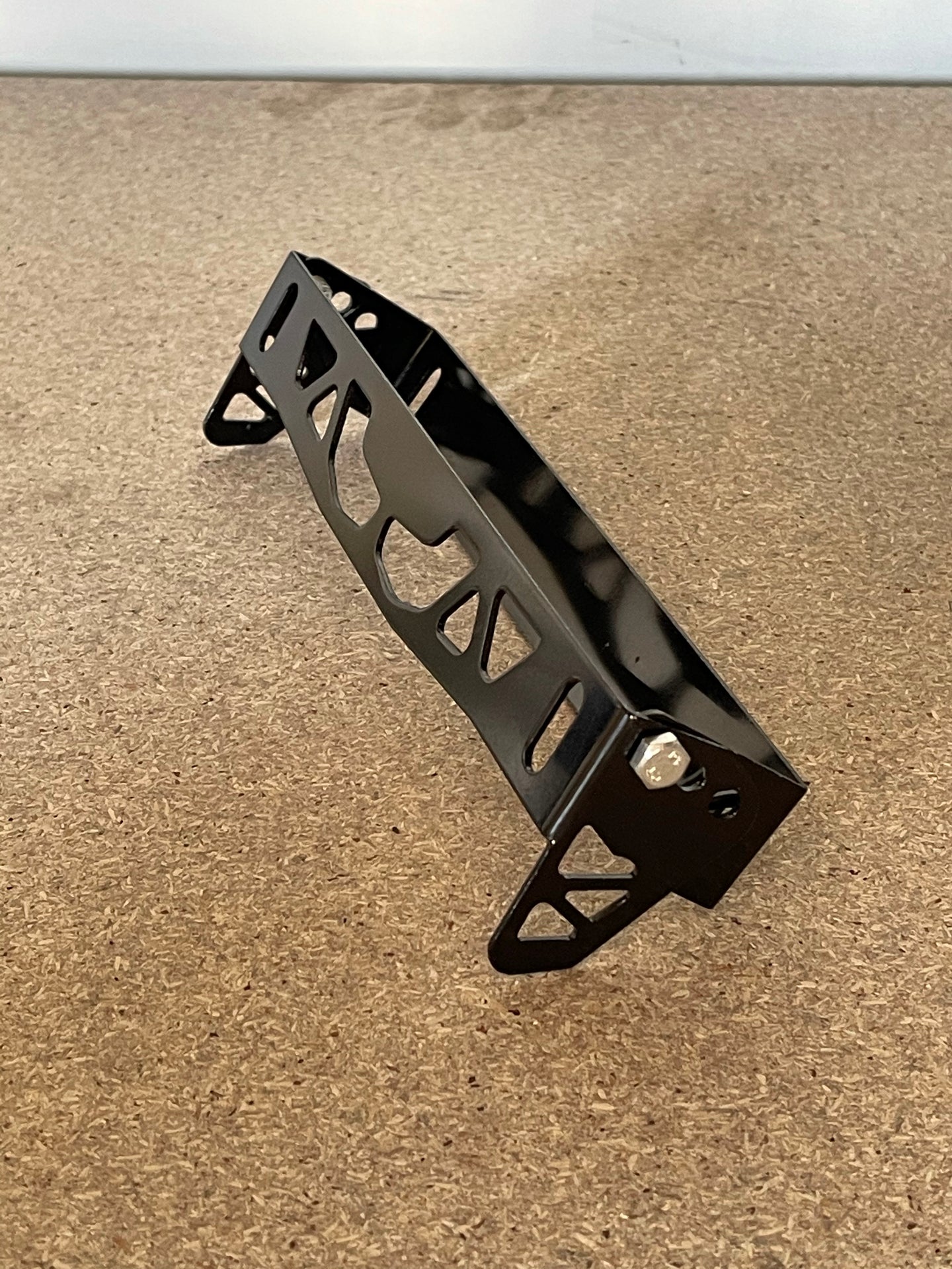 Swing up number plate bracket